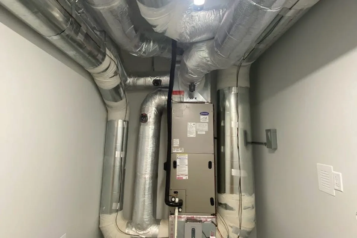 Furnace and new ductwork installed in a utility closet