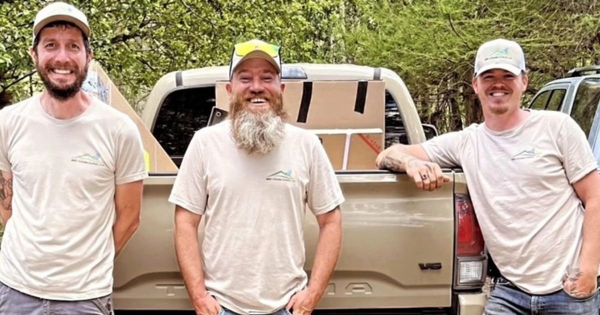Three WNC Climate Control technicians at their service truck in Weaverville, NC