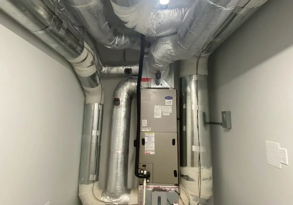 Carrier air handler and insulated ductwork in a home heating system