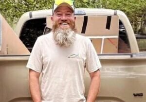 Ralph Campbell, project manager at WNC Climate Control, beside a service truck