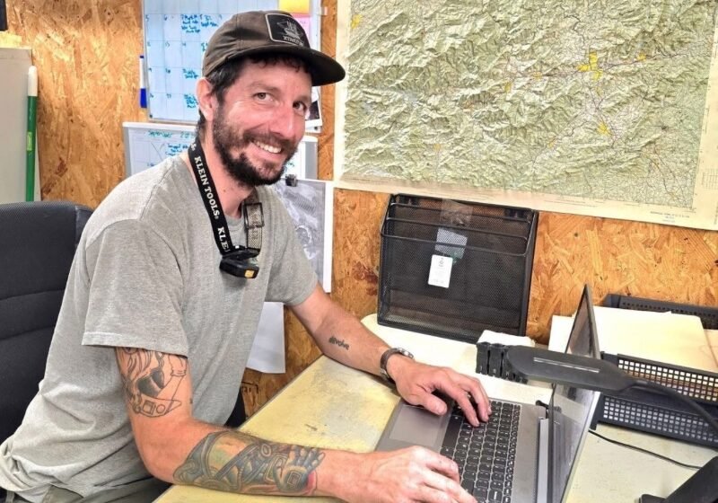 Heating and cooling team member helping customers apply for Hearth financing for a new HVAC system